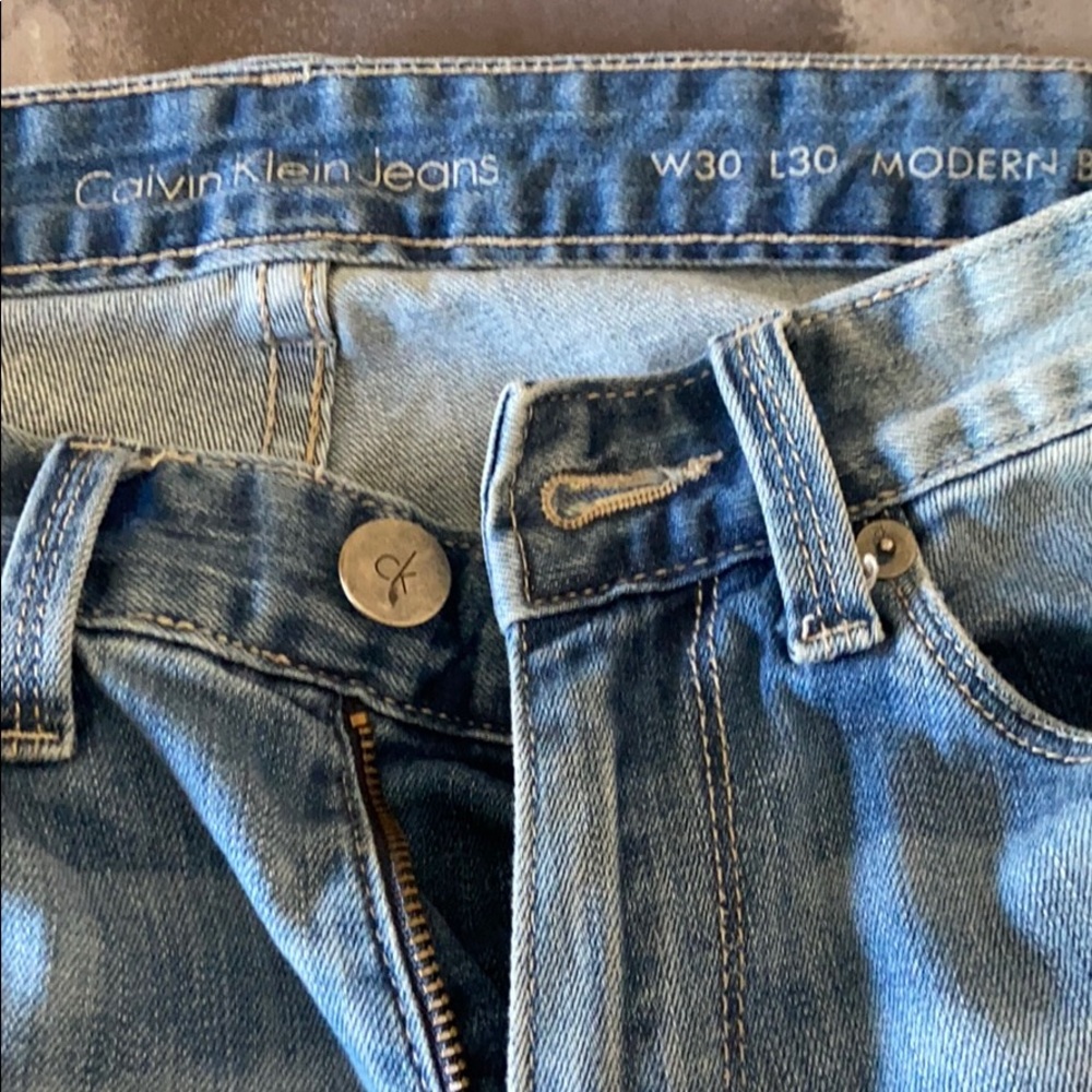 Guys Calvin Klein washed blue jeans